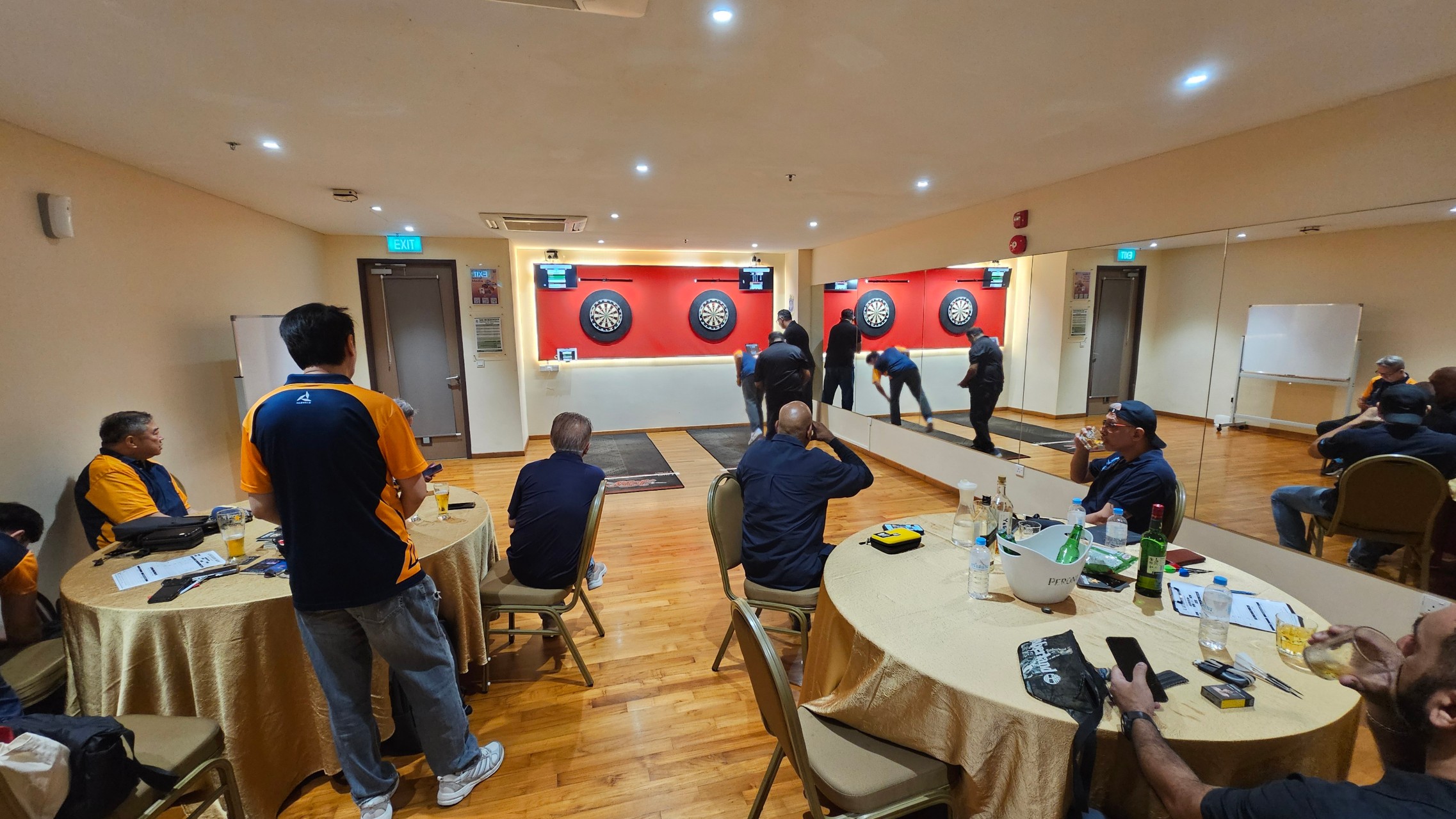 Players and spectators watching the match